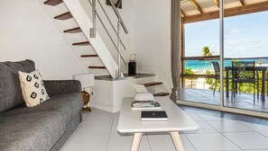 Deluxe Studio, 1 King Bed with Sofa bed, Sea View | Living area | Flat-screen TV