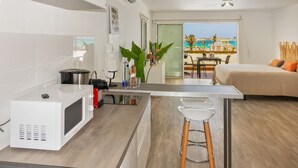 Comfort Studio, 1 King Bed, Sea View | Private kitchen | Espresso maker, fridge, microwave, stovetop - Résidence La Plage (Orient Bay)