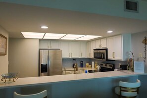 Coffee/tea maker, fridge, microwave, oven