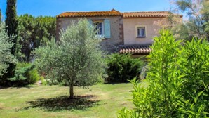 A rustic house with a tiled roof, surrounded by greenery and trees. - Mas Troumpill by Interhome (Argelès sur Mer)