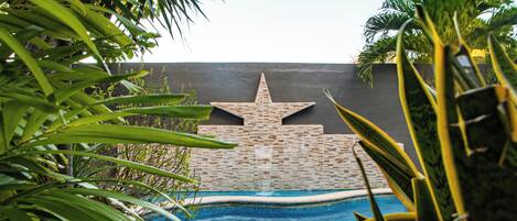 Outdoor pool, open 9:00 AM to 8:00 PM, pool loungers