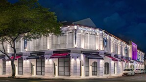 A large, historic building with the sign "MACALISTER HOTEL" prominently displayed. - Macalister Hotel Managed By The Ascott Limited (George Town)