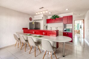 Full-sized fridge, microwave, stovetop, coffee/tea maker