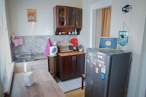 Standard Apartment, Garden View | Private kitchen | Full-sized fridge, coffee/tea maker, electric kettle - Family Hotel Mountain Scream (Tbilisi)