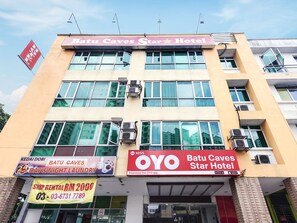 A hotel named Batu Caves Star Hotel with multiple signs advertising services like laundry and a rental shop. - 1055 Batu Caves Star Hotel (Batu Caves)