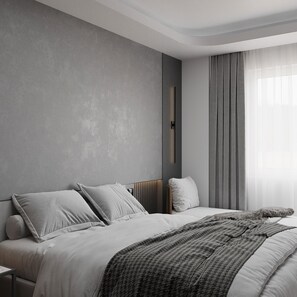 Ropa de cama hipoalergénica y caja de seguridad en la habitación