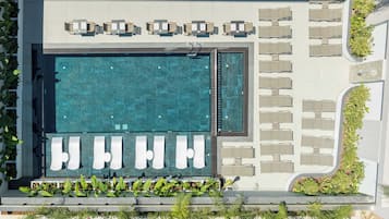 Seasonal outdoor pool, open 9:00 AM to 7:00 PM, pool umbrellas
