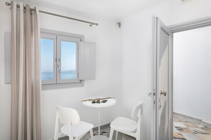 Double Room (Caldera View) | Living room | 30-inch Smart TV with satellite channels, TV - Veranda View - Adults Only (Santorini)