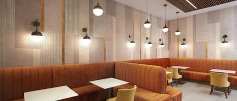 A modern restaurant interior with orange seating, white tables, and pendant lighting.