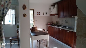 Fridge, microwave, cookware/dishes/utensils