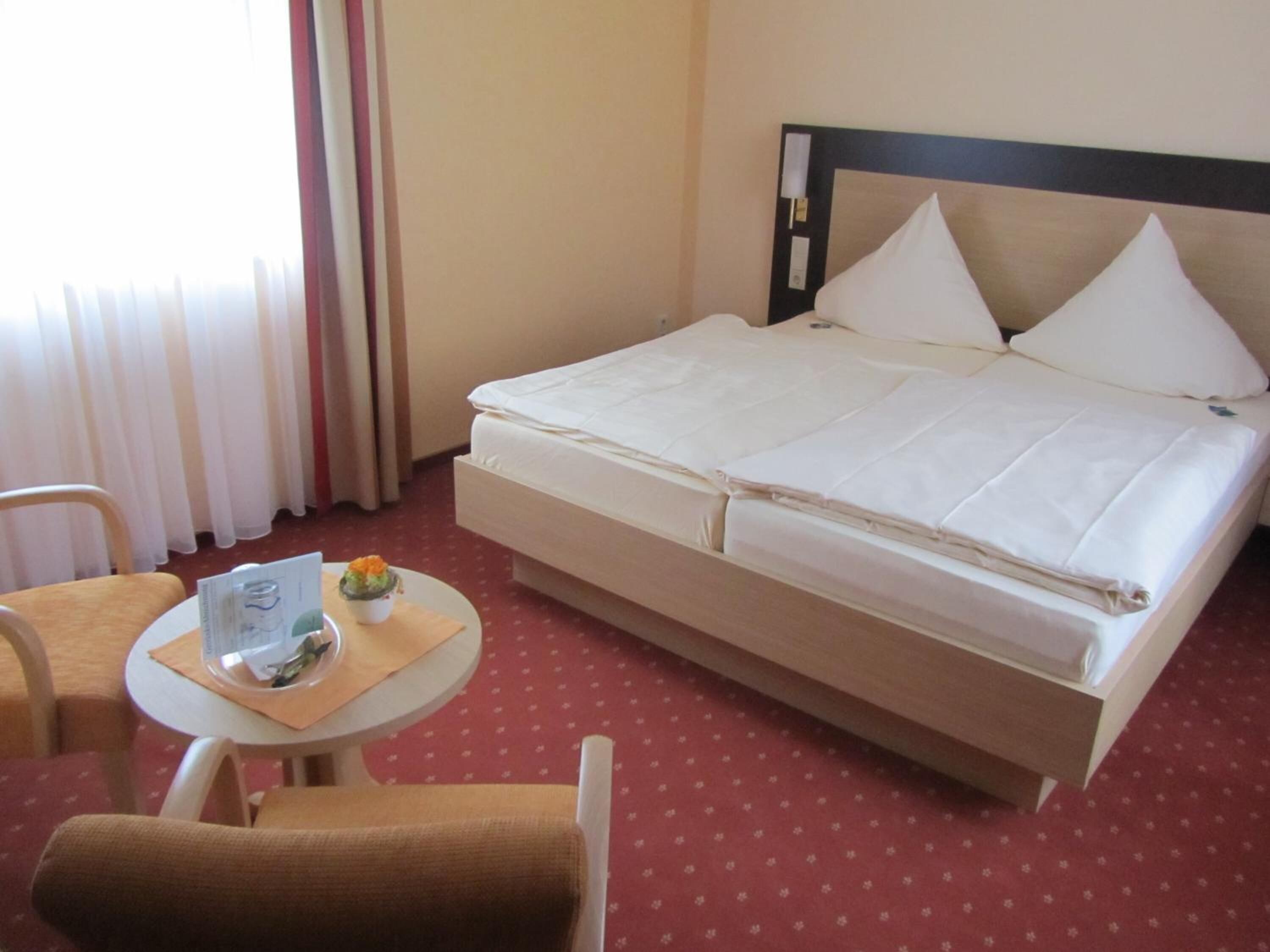 hypo-allergenic bedding, desk, laptop workspace, blackout curtains