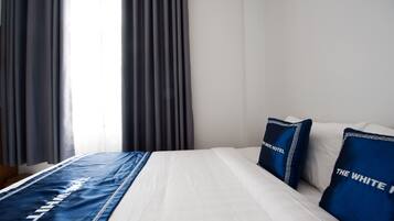 Chambre Double Deluxe | Literie hypoallergénique, minibar, rideaux occultants