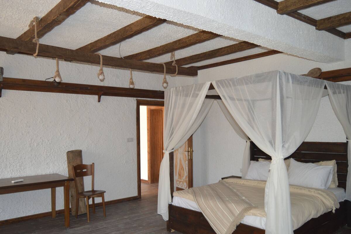 Premium bedding, desk, laptop workspace, soundproofing