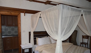 Premium bedding, desk, laptop workspace, soundproofing