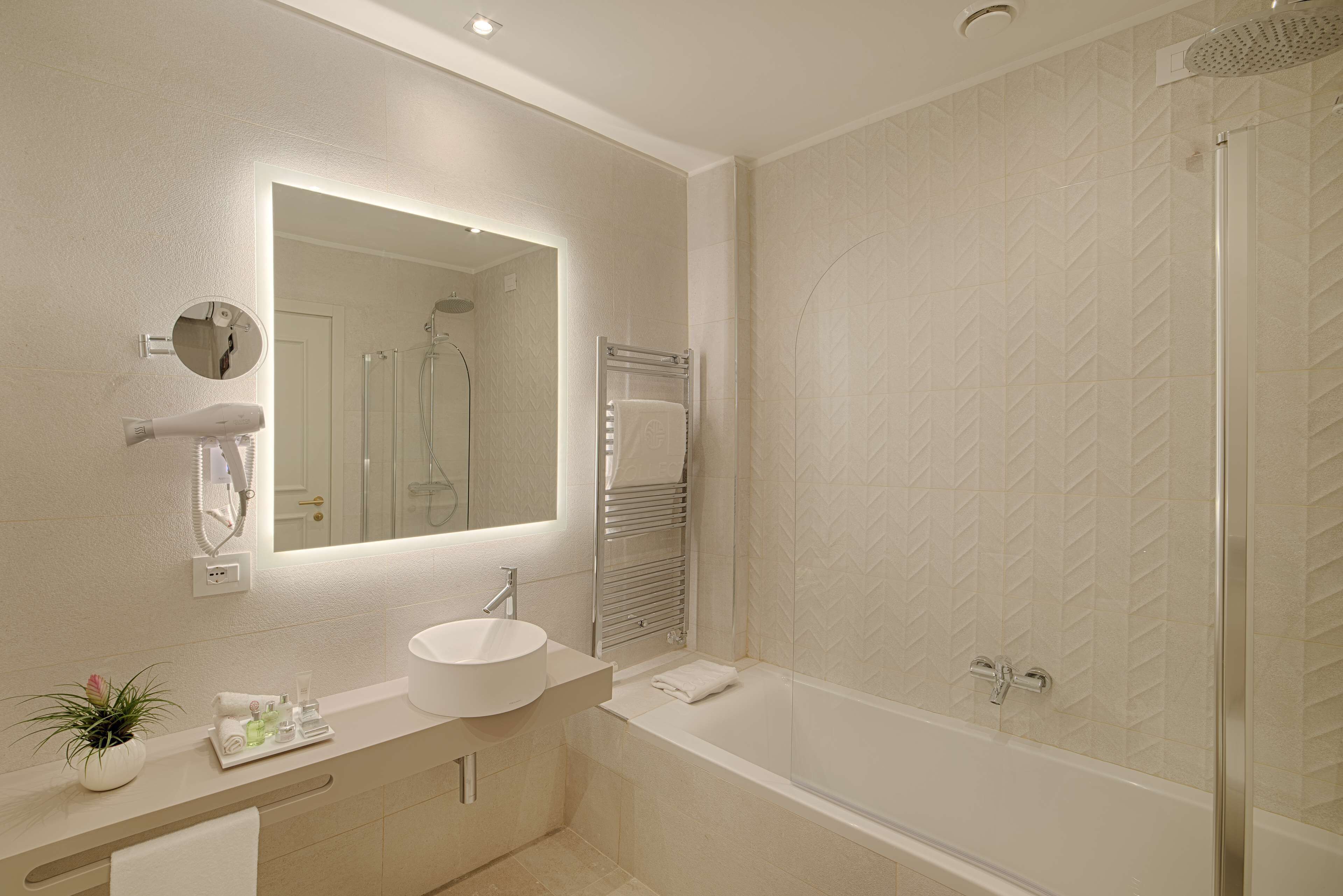superior room with view | bathroom | eco-friendly toiletries, hair dryer, towels, soap