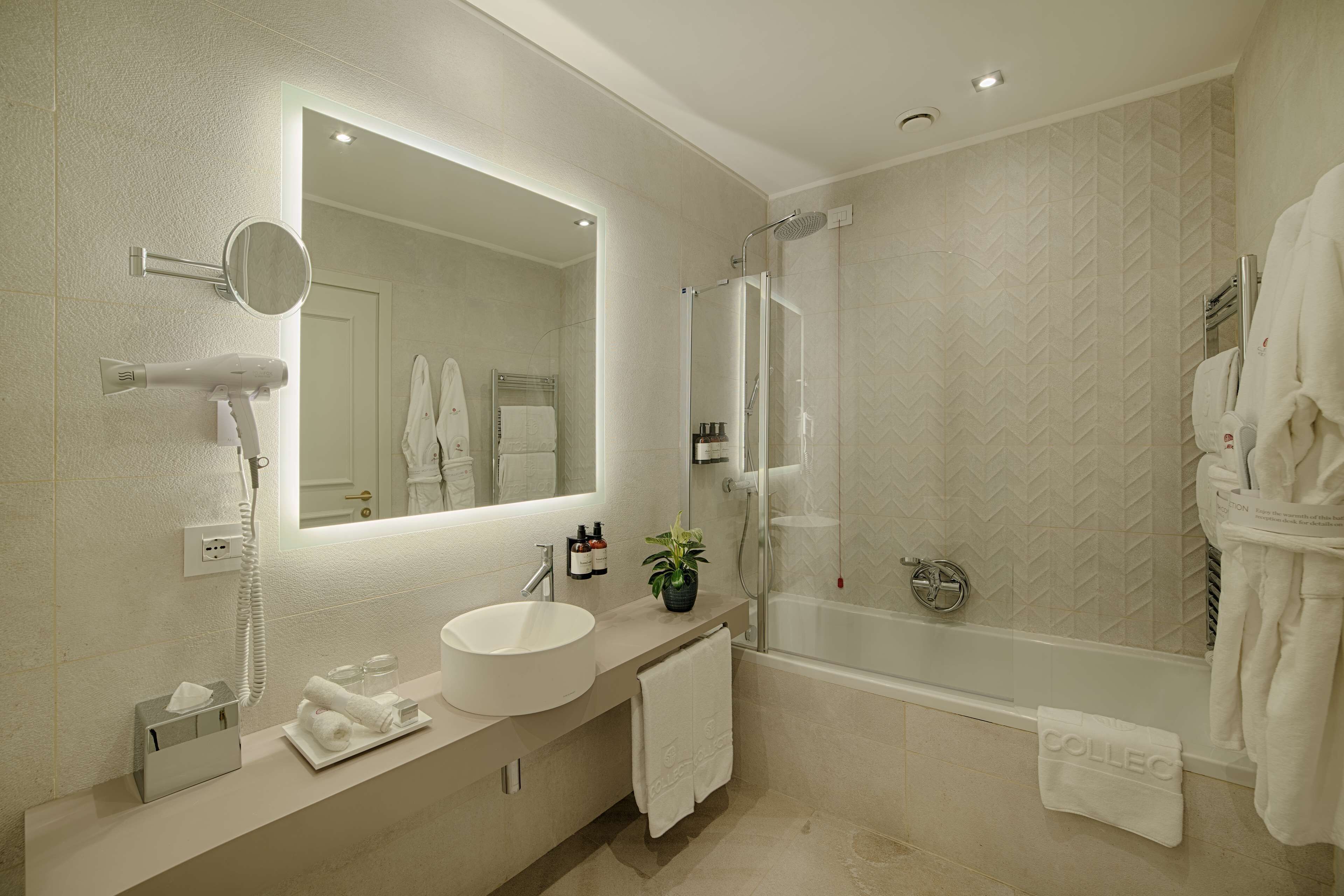 eco-friendly toiletries, hair dryer, towels, soap