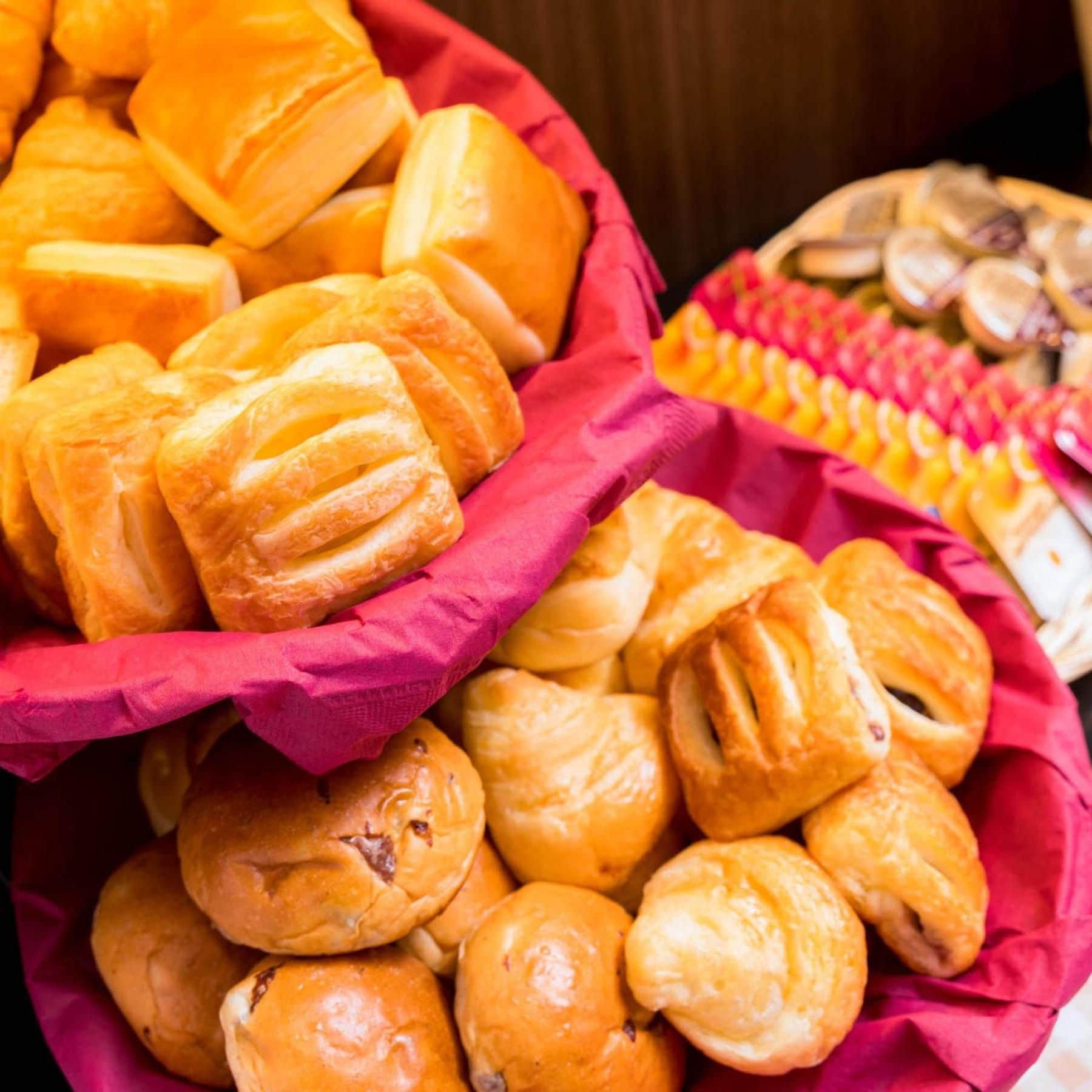 A variety of baked goods in a basket.