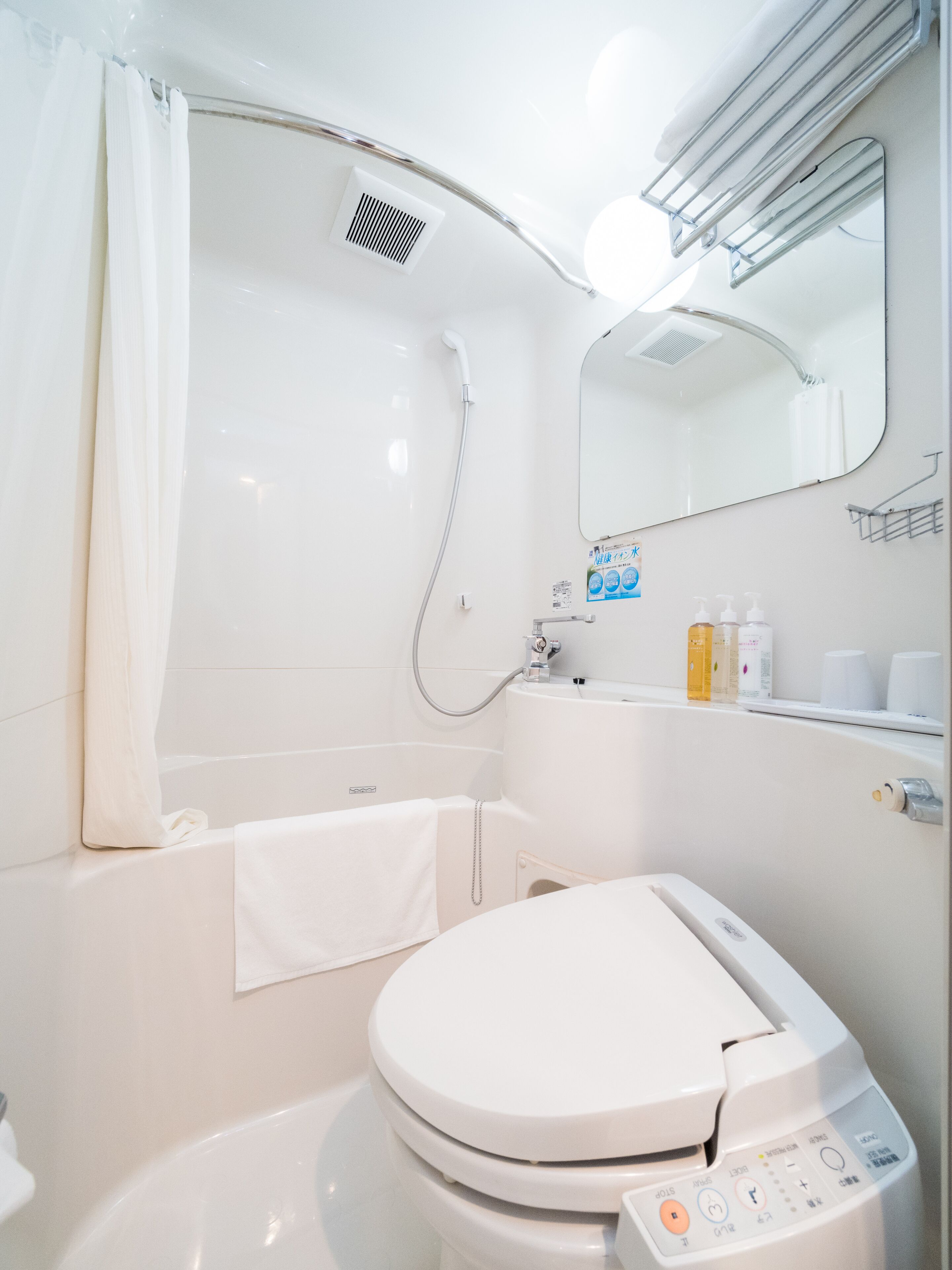 combined shower/bathtub, free toiletries, hair dryer, slippers