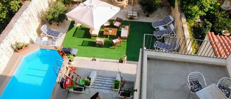 Seasonal outdoor pool, pool loungers