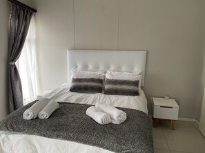 2 bedrooms, premium bedding, in-room safe, desk