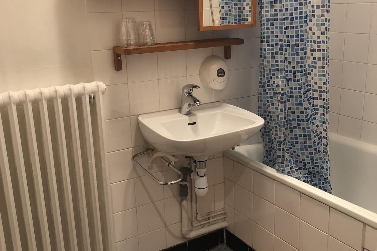 twin room, shared bathroom | bathroom | free toiletries, hair dryer, towels
