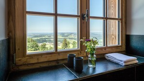 A wooden-framed window with a view of a landscape. - Chiemsee Chalet (Frasdorf)