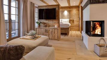 Romantic Apartment, Sauna, Mountain View | Living area | Smart TV, fireplace