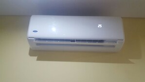 A white air conditioning unit with a digital display on the top right. - Vacation Home 2 Bedroom Luxury Home With Pool in Patroves (Albufeira)