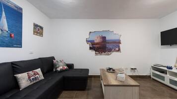 Apartment, 1 Bedroom | Living area | Flat-screen TV