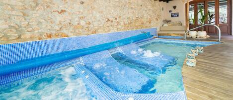 Indoor pool, open 10:00 AM to 8:00 PM, pool loungers