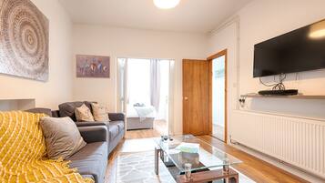 Comfort House, 4 Bedrooms | Living area | Flat-screen TV