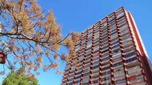 A high-rise building with multiple balconies, likely a hotel or apartment complex.