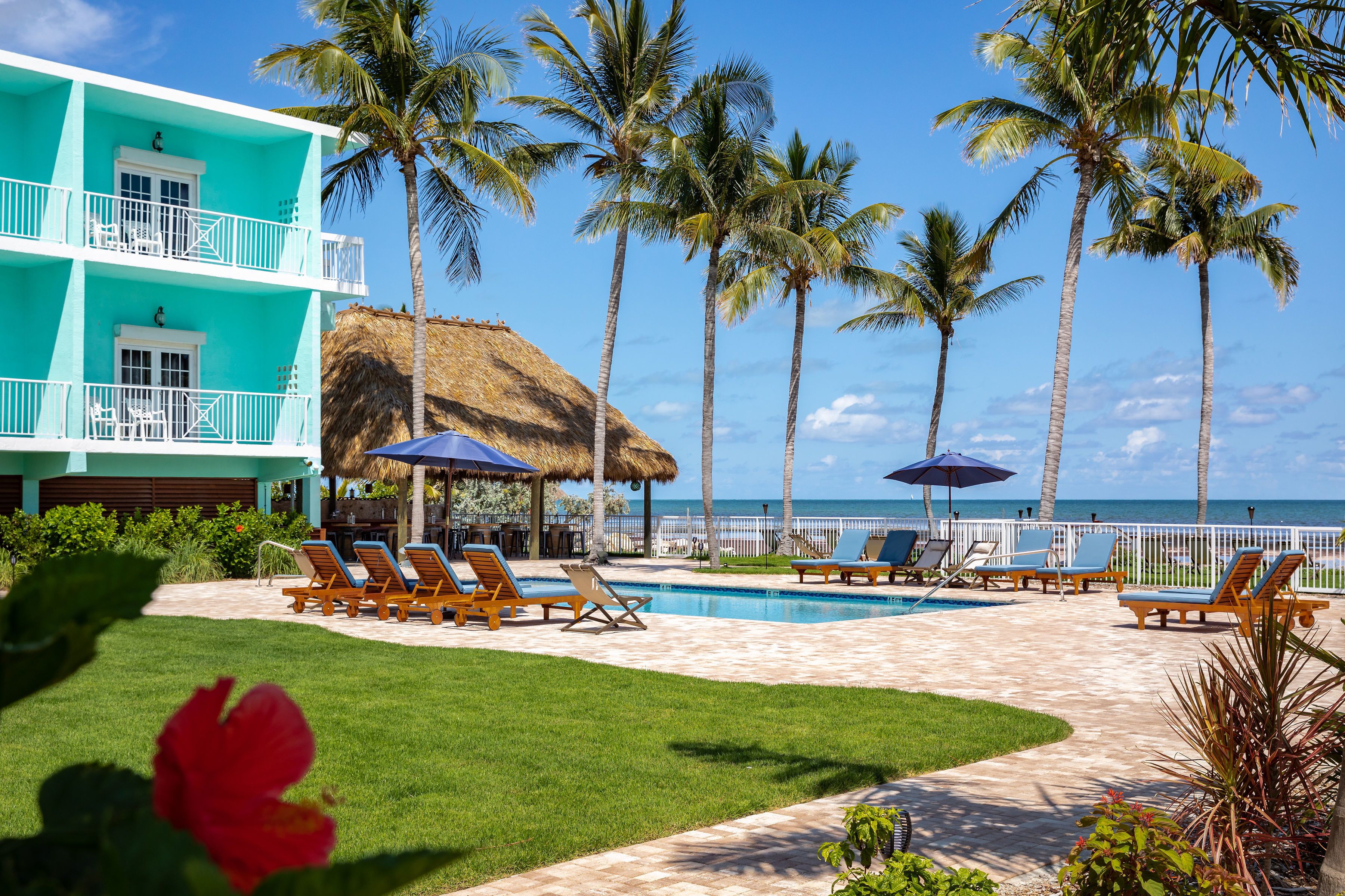 2 outdoor pools, open 7:00 am to 10:00 pm, pool umbrellas, pool loungers