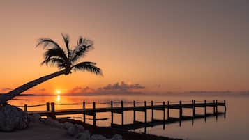 Sun loungers, beach umbrellas, beach towels, windsurfing