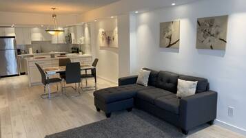 Signature Apartment, Garden View | Living area | Flat-screen TV