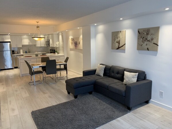 Signature Apartment, Garden View | Living area | Flat-screen TV