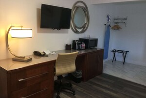Desk, laptop workspace, blackout drapes, iron/ironing board
