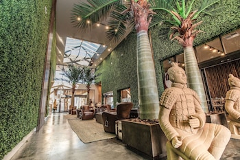 Hotel entrance and lobby at Magic Village Views Trademark Collection by Wyndham