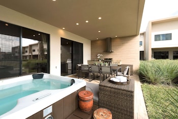 In-room safe, individually furnished, desk, blackout drapes at Magic Village Views Trademark Collection by Wyndham