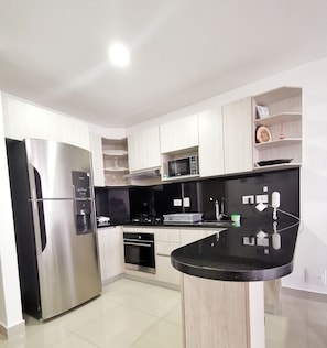 Apartment, 1 Bedroom | Private kitchen | Fridge, microwave, cookware/dishes/utensils