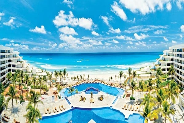 3 outdoor pools, open 8:00 AM to 8:00 PM, pool umbrellas, pool loungers - Now Emerald Cancun - All Inclusive (Cancun)