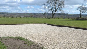 A gravel area with a tree and a view of a rural landscape. - 2 bedroom accommodation in Chard (Chard)