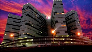 A modern building with multiple floors and a distinctive architectural design, featuring a series of balconies and a central courtyard. - Radar Cabo Corrientes (Mar del Plata)