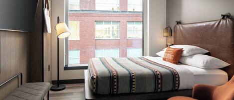 Premium bedding, pillow-top beds, desk, laptop workspace