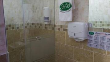 Shower, free toiletries, towels, soap