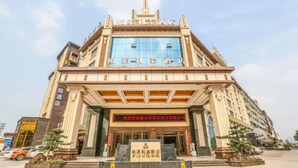 A hotel with a prominent entrance, large windows, and a signboard. - Bolailitai Hotel (Foshan)