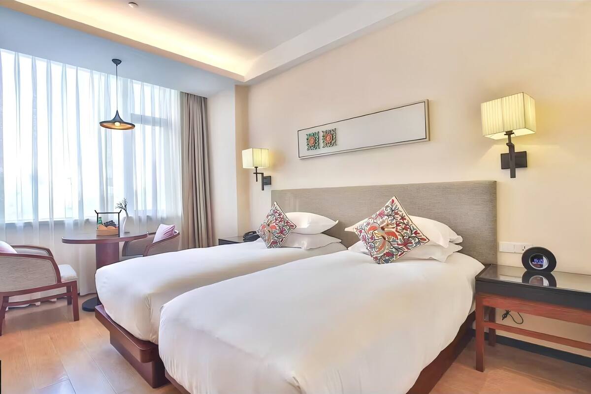 Down duvets, memory-foam beds, free minibar, desk