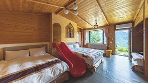 A wooden cabin room with two beds, a red slide, a window with curtains, and a view of mountains. - Julie's Garden (Ren'ai)