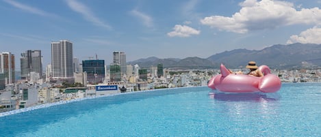 Outdoor pool, pool umbrellas, sun loungers