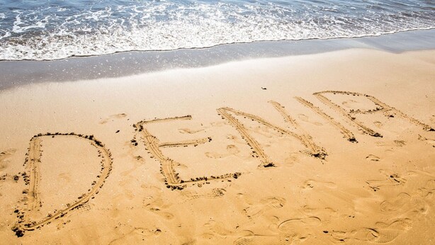 A beach with the word "DENIA" written in the sand. - 0676 Villa Molins Tauro (Denia)